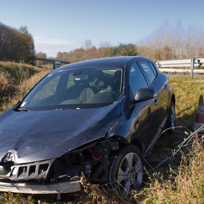 damaged car near the road