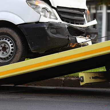 white car being towed